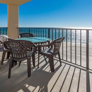 Enjoy breathtaking views from the balcony, featuring a glass-top table and comfortable seating for relaxation