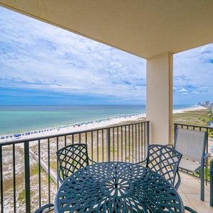 Balcony seating offers a serene view of the beach and gulf, perfect for relaxing while enjoying the coastal atmosphere