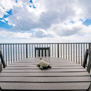 Enjoy stunning views from the balcony dining table, perfect for relaxing moments by the tranquil waters