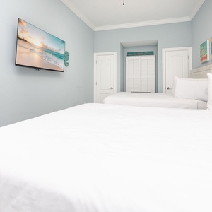 Unwind in this queen guest suite and stream your favorite shows or enjoy a good movie after a beach day