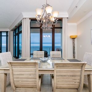 Gather around the dining table, enjoying the views as you share laughter and unforgettable moments with loved ones
