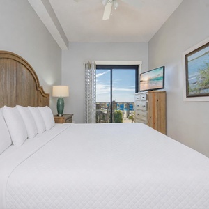 Drift into restful nights on soft king bedding in the master suite, with patio views awaiting you
