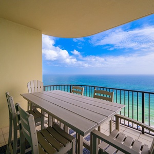 Savor the calming views while gathering around your balcony table, creating cherished moments in this serene spot