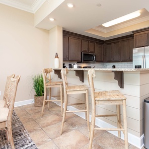 Sip your morning coffee at the breakfast bar and get ready for a beach day in this stylish space