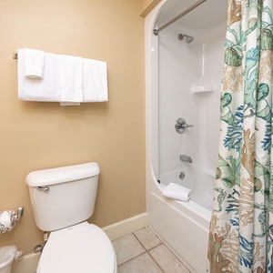 Freshen up in this guest bath in the relaxing shower or soothing tub before an exciting day