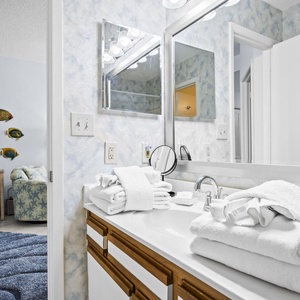 Refresh and unwind at the vanity, surrounded by fluffy towels that invite you to indulge in morning routines