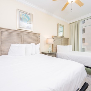 Sink into fluffy queen beds with soft linens for a restful night, enjoying the coastal views from the windows