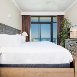 Experience restful nights in the soft queen bedding, while enjoying beautiful coastal balcony views in this guest suite