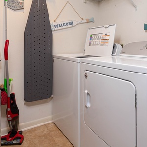 Utilize the convenient laundry area with a washer and dryer, making it easy to refresh your beach attire during your stay