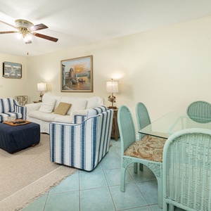 Cozy up on the plush sofa, surrounded by charming decor while flipping through your favorite shows