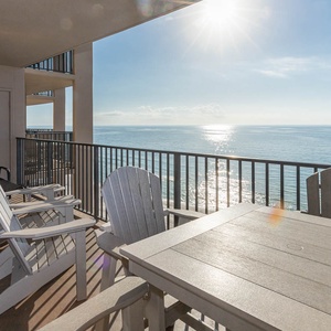 Enjoy the fresh air while seated at the table or in comfortable chairs, soaking in the expansive beach views