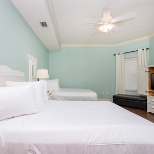 Drift into relaxation in this guest suite with two double beds and twin ottoman