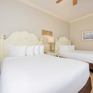 Rest comfortably in this inviting queen guest suite, where plush bedding and beach decor create a relaxing vibe