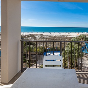 Take in breathtaking beach views from your balcony while unwinding at the outdoor dining table, enjoying the gentle breeze