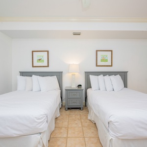Rest comfortably in this guest suite with two doubles, where soft bedding and tranquil decor create a perfect retreat