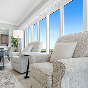 Settle into a plush chair by floor-to-ceiling windows and feel gulf breezes as the beach stretches below