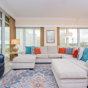 Sink into the plush sectional, enjoying cozy chats and laughter while gazing at the stunning coastal views