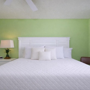 Wake refreshed for your beach adventures in the master suite with a cozy king bed and stunning views