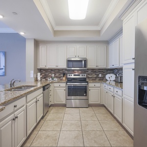 Craft delightful culinary creations in the spacious kitchen, perfect for sharing joyful moments with loved ones