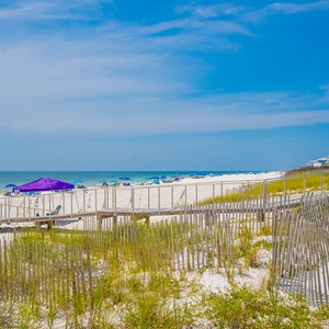 Relax by the water with stunning views of the vibrant buildings and lush greenery, perfect for your getaway to Gulf Shores