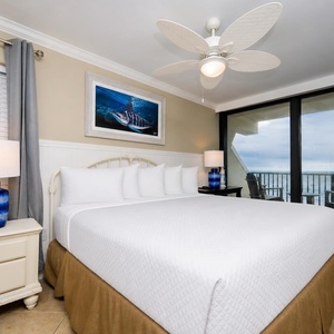 Retreat to the king suite after a fun day and relax with the sights and sounds of the beach from the balcony