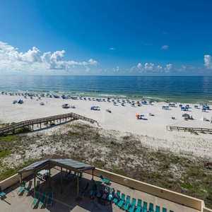 Relax with stunning views of the sandy beach and inviting blue waters from your private balcony