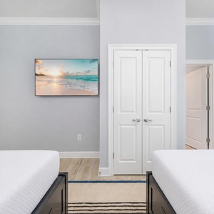 Relax after a day at the beach with your favorite shows in this cozy queen guest suite
