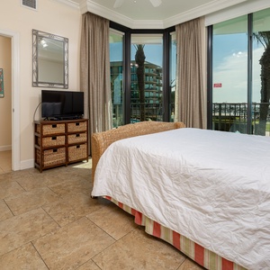 Wake to a breathtaking sunrise in this guest suite with expansive views from the windows