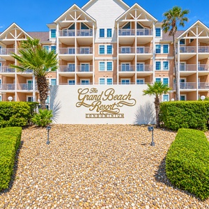 Experience the welcoming charm of Grand Beach Resort with lush landscaping and easy access to the beautiful beach