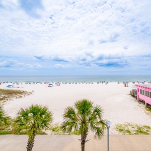 Enjoy breathtaking views of the shimmering water and expansive shoreline, perfect for relaxation and beach walks
