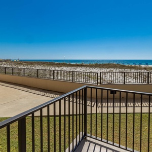Step out to the patio and enjoy the refreshing breeze with views of the beach and tranquil waters just beyond