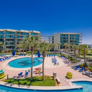 Discover the pool area with a refreshing lazy river and thrilling waterslide, just steps from the bay