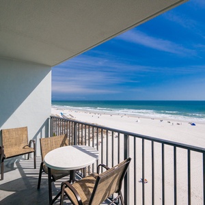 Relax on your balcony with a gentle breeze and the rhythmic sound of waves meeting the shore