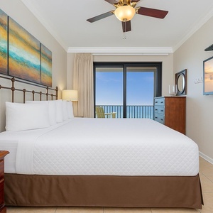 Awaken to soft sunlight in your plush king bed, with serene coastal views inviting you to your balcony