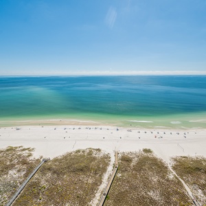 Marvel at sweeping beach views from your balcony, embracing sunshine and warmth while listening to gentle waves