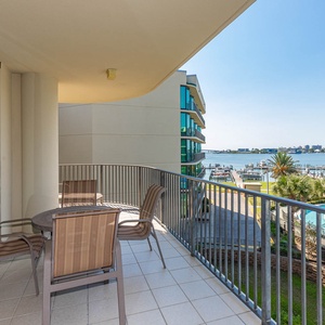 Enjoy tranquil moments on the balcony, soaking in the serene bay views and refreshing coastal breeze