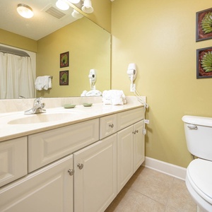 Experience refreshing mornings as you prepare for the day in this guest bath, accented by vibrant decor