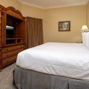 Relax on the cozy king bed in this guest suite and stream your favorite shows after a beach day