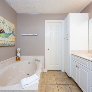 Indulge in relaxation in the master bath with a refreshing walk-in shower and soothing jetted tub