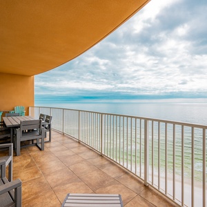 Lounge comfortably on the spacious balcony, soaking in the calming sights and sounds of the coastline