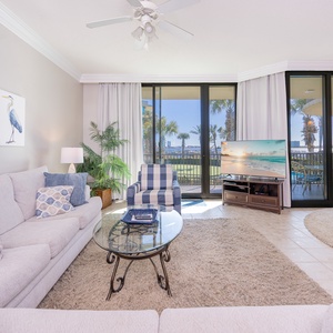 Relax in the inviting living area on the sofa with queen sleeper enjoying a gentle breeze with your favorite shows