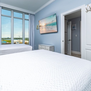 Unwind with views of the surrounding area and a good movie in this queen guest suite