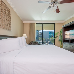 Unwind after a fun vacation day and stream your favorite shows in the king master suite with balcony access