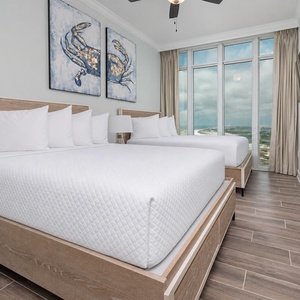 Wake to breathtaking scenery in this queen guest suite with two cozy beds and expansive views from the windows