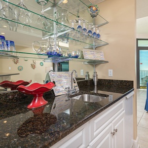 Mix refreshing drinks at the wet bar, then relax on your balcony with stunning views of the coast