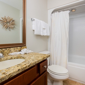 Refresh and rejuvenate in this guest bathroom, featuring a spacious vanity and a soothing shower