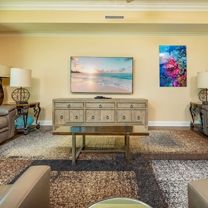 Soft leather recliners invite you to sink in and share movie nights in this relaxing living room