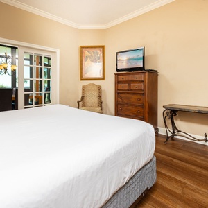 Unwind after a day at the beach in this elegant king master suite surrounded by stylish coastal accents