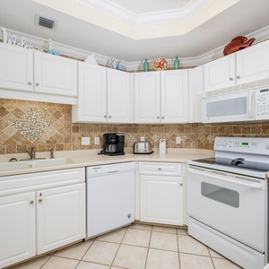 Craft delightful meals in this cheerful kitchen with a coffee maker with Keurig and traditional style brews