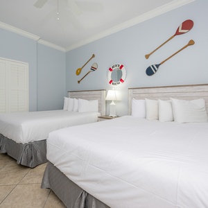 Rest peacefully in this queen guest suite, surrounded by beach decor that invites relaxation after a day of adventures